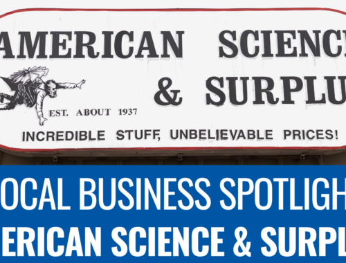 A photo of the American Science & Surplus sign. A blue banner underneath it reads: Local Business Spotlight American Science & Surplus.